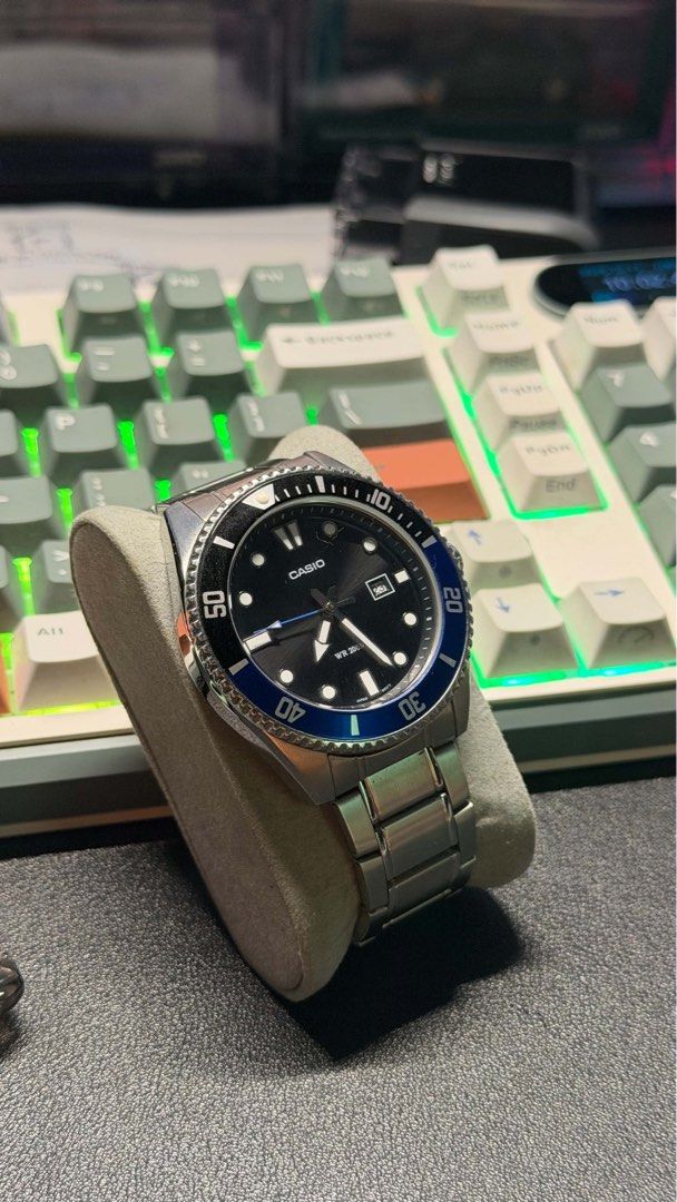 Casio Diver Watch Black Dial Blue Bezel (Category: Men's Watches) located in Tuguegarao City. Submitted by vharley777 (Listing ID 1468213143, Image 1). Description: - Brand: Casio Analog Watch - Design: Black dial with a stylish blue bezel and white markers/hands - Material: Durable stainless steel case and bracelet - Features: Date window at 3 o'clock position and sweeping second hand - Water Resistance: 200m (Great for swimming and snorkeling) 