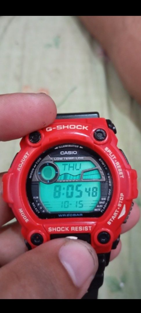 Casio G-Shock G-7900A Red Black Digital Watch (Category: Men's Watches) located in Manila. Submitted by jhonevanma58082 (Listing ID 1468059649, Image 3). Description: - Model: Casio G-Shock G-7900A (Bright Red Bezel & Black Resin Strap) - Functions: Moon and Tide Graph, Low Temp LCD Display, Backlight (tested and working) - Durability: Shock Resistant, 20 Bar (200M) Water Resistant - Condition: Standard wear on strap and case from normal use; cle