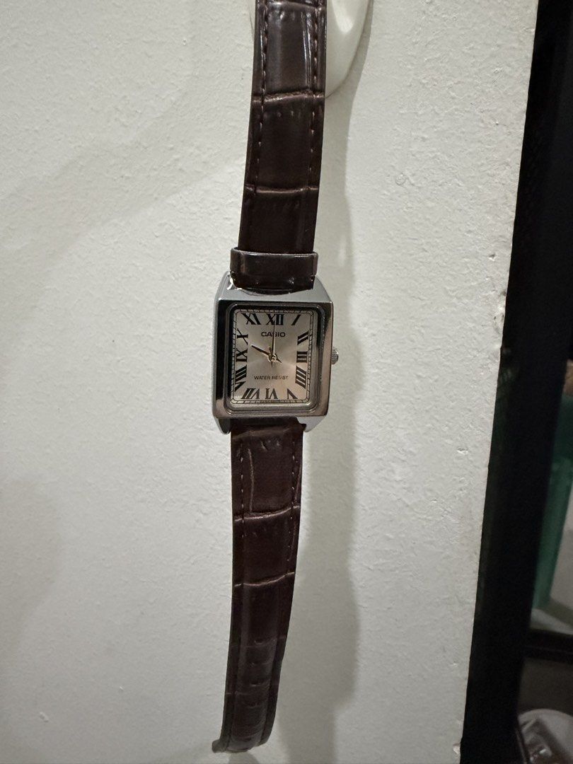 Casio Tank Roman Numeral Watch Brown Leather Strap (Category: Women's Watches) located in Pasay City. Submitted by gerlynnedc (Listing ID 1468211341, Image 1). Description: - Brand: Casio Tank Watch - Dial: Silver with classic black Roman numerals and minimalist hands - Case: Silver-tone rectangular case - Strap: Dark brown faux-croc leather strap - Movement: Reliable quartz movement with water resistance - Style: Vintage dress watch vibe, ideal 