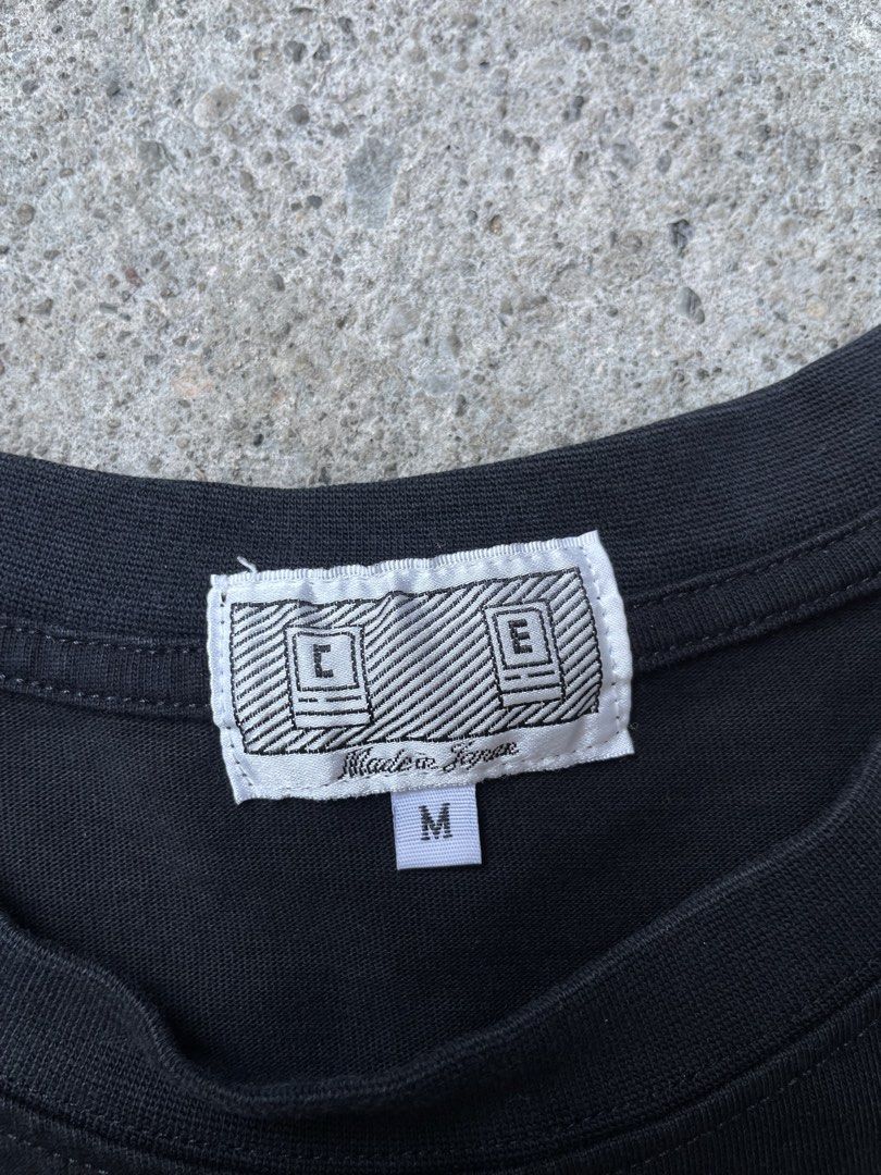 Cav Empt C.E. Graphic Print Black T-Shirt (Category: Tshirts & Polo Shirts ) located in Siniloan. Submitted by rethr1ft (Listing ID 1468085648, Image 3). Description: - 27x20 dimes Cav Empt t-shirt in black, size medium. Made in Japan, 100% cotton construction. Small Cav Empt branding text printed on the front chest. Large colourful graphic print on the back featuring a helmet and scooter design. Standard crew neckline and short sleeves. Interior