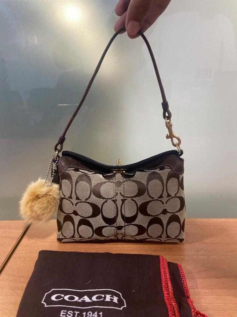 CCH Mini Turnlock (Category: Purses & Pouches) located in Manila. Submitted by sb_onlinestore (Listing ID 1468106752, Image 2). Description: - No rubs - Leather is slightly used - Good hardware - Clean exterior - Minimal dirt inside.