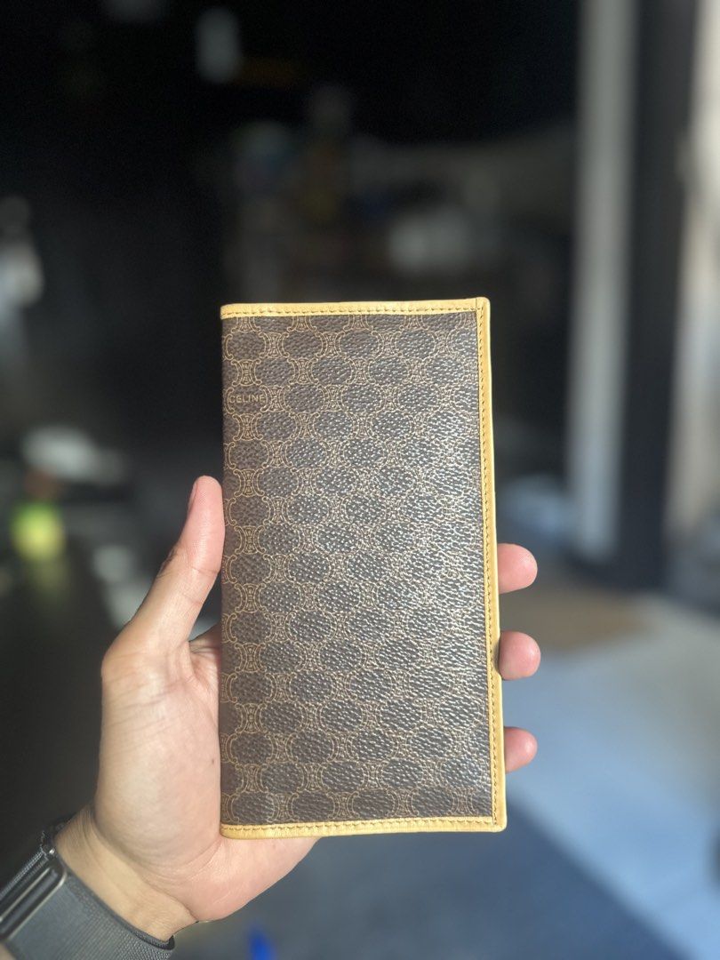 Celine Paris Triomphe Macadam Long Wallet Brown Tan (Category: Luxury Bags & Wallets) located in Makati City. Submitted by js0615 (Listing ID 1468278831, Image 1). Description: - Brand: Celine Paris (Made in Italy) -Vintage - Exterior: Brown canvas with iconic monogram and Triomphe motif - Interior: Smooth tan leather with clean lining and gold-stamped logo - Organization: Multiple card slots and cash compartments - Design: Slim profile, folds fl