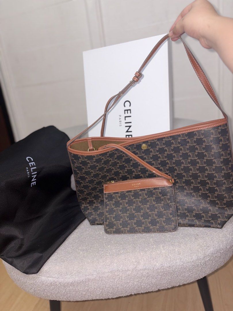 Celine Triomphe Canvas Cabas Tote Bag (Category: Tote Bags) located in Manila. Submitted by axchichaaa (Listing ID 1468177964, Image 2). Description: - Authentic Celine Triomphe Canvas Cabas Tote - Color: Brown with tan leather trim - Features open top with secure snap button closure - Includes matching zippered pouch attached inside - Clean interior lining - Tan leather shoulder strap for comfortable wear - Comes complete with black dust bag and