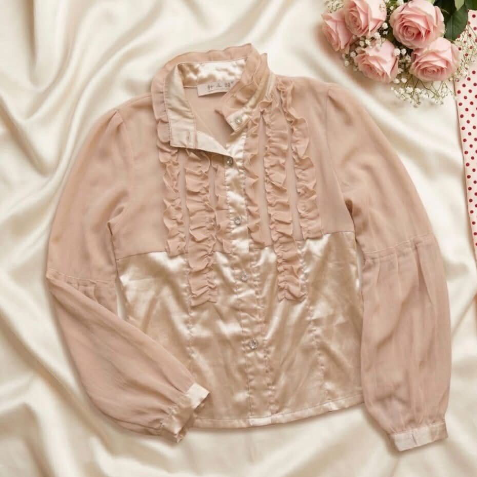 Champagne-toned blouse (Category: Blouses) located in Manila. Submitted by elyvelleee (Listing ID 1468255577, Image 1). Description: Prettiest champagne-toned blouse with that luxurious, yayamanin look! 🥂🎀 Featuring delicate ruffle details, a glossy satin-like finish, and elegant long sleeves for a soft and sophisticated appearance. ♡ Beautiful champagne beige color ♡ Romantic ruffle details along the neckline ♡ Elegant sheen for a classy finis