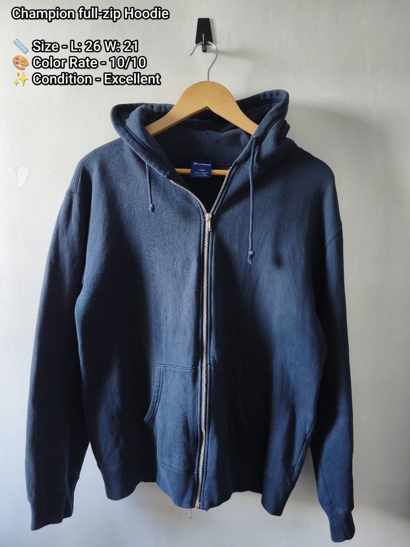 Champion full-zip Hoodie (Category: Hoodies) located in Manila. Submitted by gelog2 (Listing ID 1468146327, Image 1). Description: - Brand: Champion - Color: Dark blue - Style: Full-zip hoodie with front pockets and matching drawstrings - Fit: Ribbed cuffs and hem for a snug fit - Measurements: 26 inches length x 21 inches width - Condition: Clean fabric, no noticeable flaws, solid everyday layering piece.