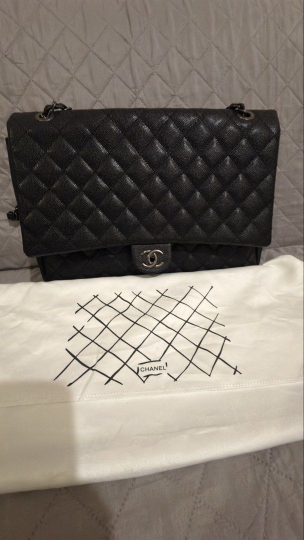 XXL Chanel Airport Bag (Category: Luxury Bags & Wallets) located in Manila. Submitted by nekynek (Listing ID 1468192949, Image 2). Description: -XXL Chanel Airport Bag in Caviar - Silver Hardware - Signature interlocking CC twist lock closure - Classic quilted pattern with a convenient back slip pocket - Convertible leather-woven double chain strap - Clean interior with Chanel Paris stamped hardware - Includes branded white dust bag with quilted 
