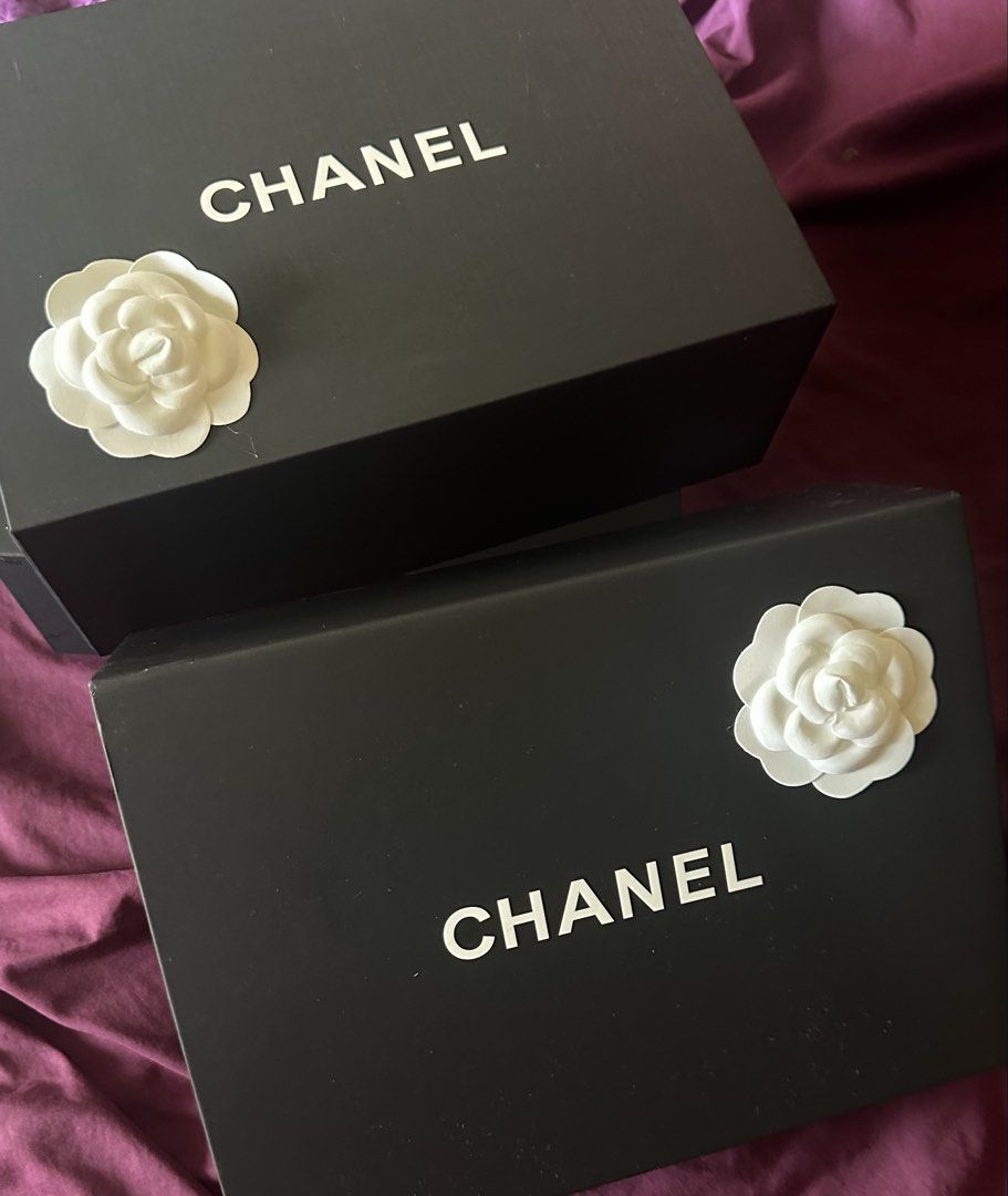 Chanel Box SMALL with Camellia Flower (Category: Accessory Holder, Box & Organizers) located in Makati City. Submitted by 888trixie888 (Listing ID 1468132685, Image 3). Description: - Chanel magnetic gift box in sleek black - Features the iconic bold white logo on top - Comes with the signature white camellia flower decoration - Interior dimensions: roughly 8.5 x 11 inches - Ideal for luxury storage, display, or gifting LALAMOVE SHIPPING.