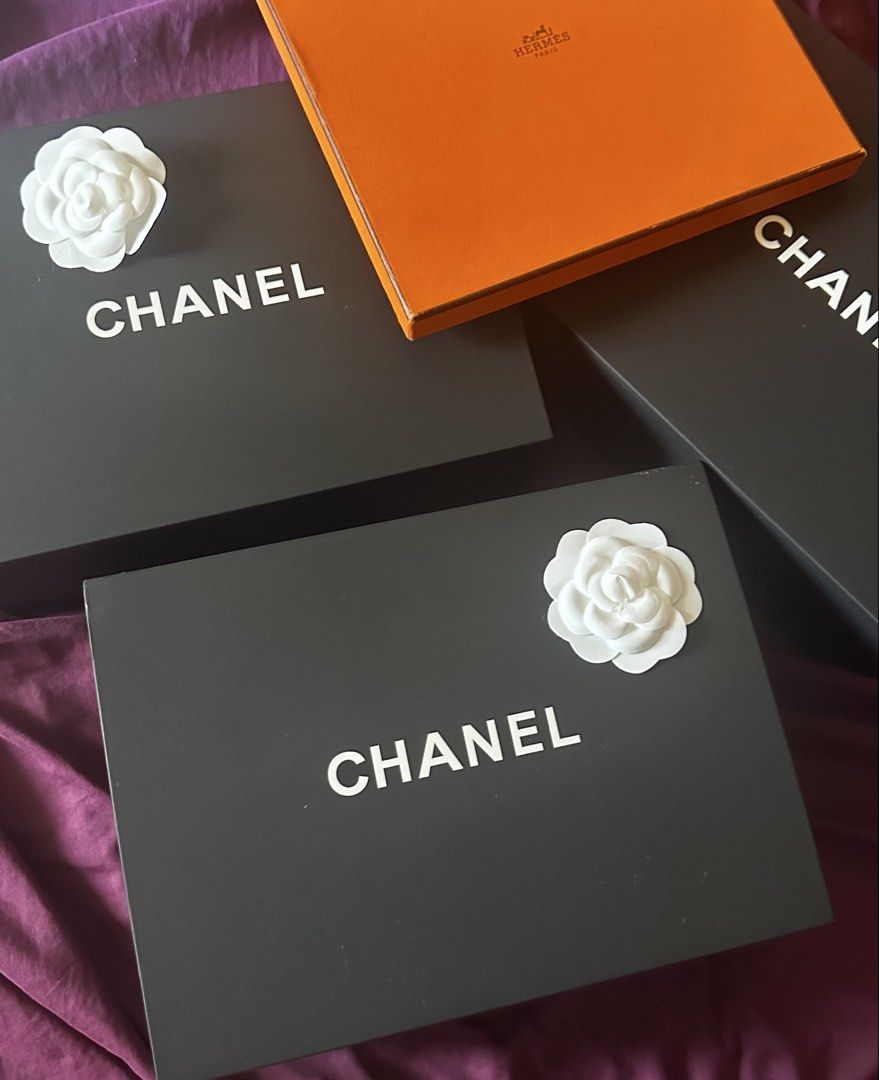 Chanel Box SMALL with Camellia Flower (Category: Accessory Holder, Box & Organizers) located in Makati City. Submitted by 888trixie888 (Listing ID 1468132685, Image 1). Description: - Chanel magnetic gift box in sleek black - Features the iconic bold white logo on top - Comes with the signature white camellia flower decoration - Interior dimensions: roughly 8.5 x 11 inches - Ideal for luxury storage, display, or gifting LALAMOVE SHIPPING.