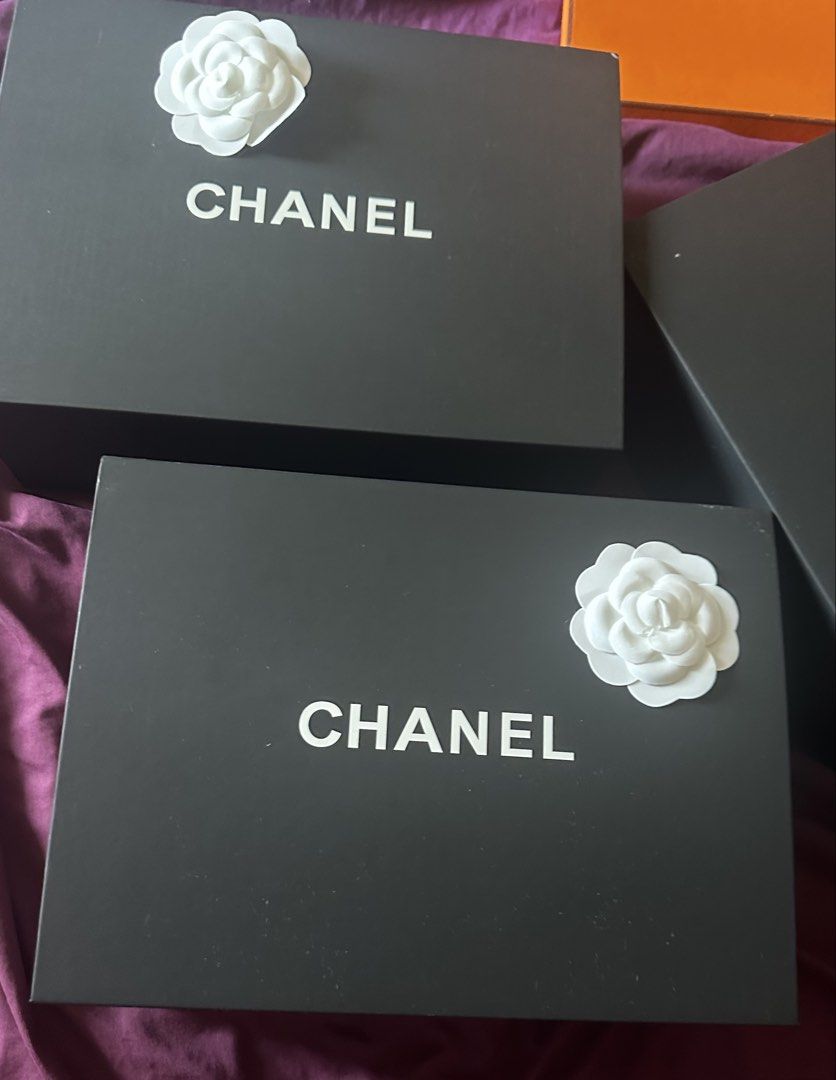 Chanel Box SMALL with Camellia Flower (Category: Accessory Holder, Box & Organizers) located in Makati City. Submitted by 888trixie888 (Listing ID 1468132685, Image 2). Description: - Chanel magnetic gift box in sleek black - Features the iconic bold white logo on top - Comes with the signature white camellia flower decoration - Interior dimensions: roughly 8.5 x 11 inches - Ideal for luxury storage, display, or gifting LALAMOVE SHIPPING.