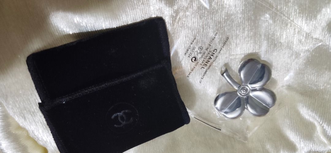 Chanel Clover Brooch Pin with Pouch (Category: Brooches) located in Caloocan City. Submitted by refreshmycloset444 (Listing ID 1468248381, Image 2). Description: - Authentic Chanel skincare promotional four-leaf clover brooch - Elegant silver-tone metal finish with a delicate CC logo in the center - Brand new and still sealed in its original clear plastic packaging - Includes a luxurious black velvet storage pouch with the embossed Chanel logo - 