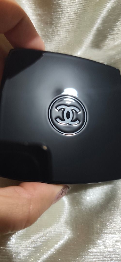 Chanel Double Mirror Compact Black (Category: Makeup) located in Caloocan City. Submitted by refreshmycloset444 (Listing ID 1468247820, Image 2). Description: - Brand: Chanel - Color: Classic black with iconic white interlocking CC logo - Design: Square shape with rounded corners, fits easily in handbags or pockets - Mirrors: Dual interior mirrors featuring regular and magnifying views - Condition: Clean surface with plastic intact on mirror - Cl