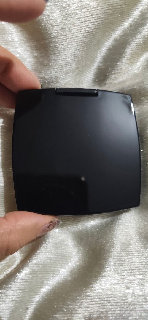 Chanel Double Mirror Compact Black (Category: Makeup) located in Caloocan City. Submitted by refreshmycloset444 (Listing ID 1468247820, Image 3). Description: - Brand: Chanel - Color: Classic black with iconic white interlocking CC logo - Design: Square shape with rounded corners, fits easily in handbags or pockets - Mirrors: Dual interior mirrors featuring regular and magnifying views - Condition: Clean surface with plastic intact on mirror - Cl