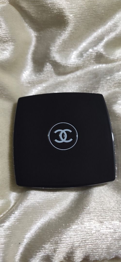 Chanel Double Mirror Compact Black (Category: Makeup) located in Caloocan City. Submitted by refreshmycloset444 (Listing ID 1468247820, Image 1). Description: - Brand: Chanel - Color: Classic black with iconic white interlocking CC logo - Design: Square shape with rounded corners, fits easily in handbags or pockets - Mirrors: Dual interior mirrors featuring regular and magnifying views - Condition: Clean surface with plastic intact on mirror - Cl