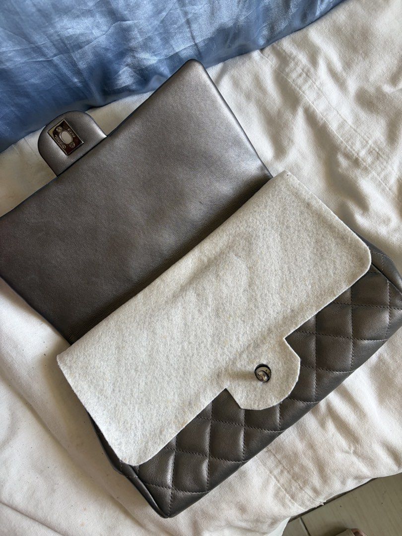 Chanel Quilted Metallic Grey Flap Bag (Category: Luxury Bags & Wallets) located in Pasig City. Submitted by sherlock2024 (Listing ID 1468062825, Image 2). Description: - Authentic Chanel quilted shoulder bag - Rare metallic grey leather with a subtle shimmer finish - Classic CC turnlock closure and elegant chain strap - Interior features matching lining and a cardholder pocket slot - Includes original authenticity card.