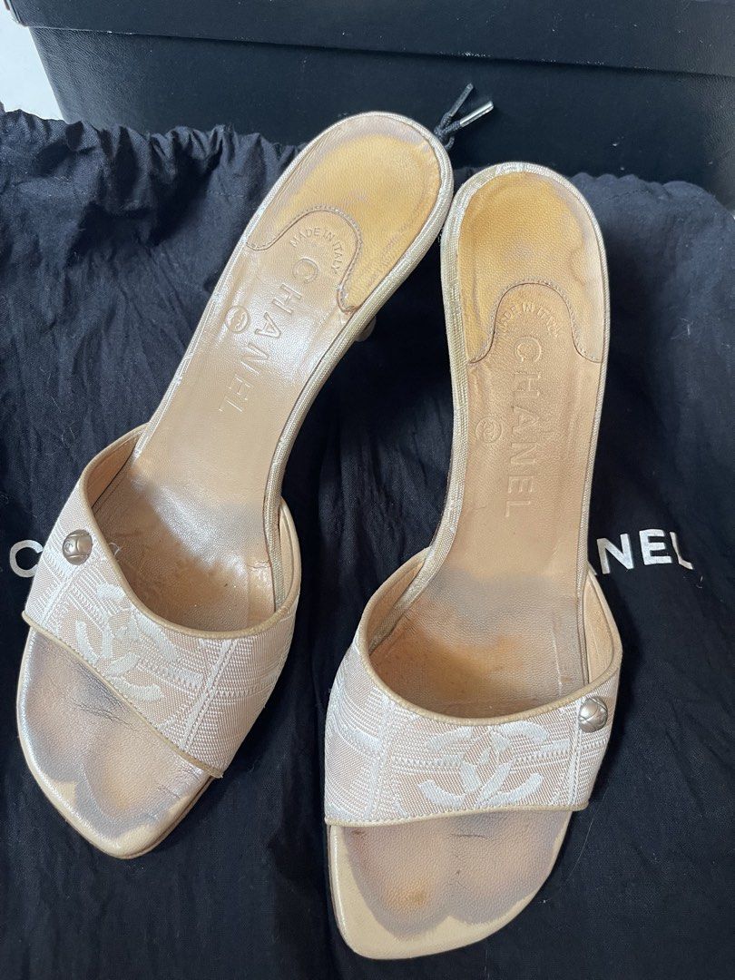 Chanel Travel line CC Canvas Heels (Category: Sneakers & Footwear) located in Davao. Submitted by boodle4lyf (Listing ID 1468104529, Image 2). Description: Authentic Chanel beige canvas CC logo mules in size 37.5, made in Italy. Features a slip-on kitten heel, quilted heel, and CC button accent. Shows significant wear on footbeds, toes, and soles. Includes original box and dust bag..
