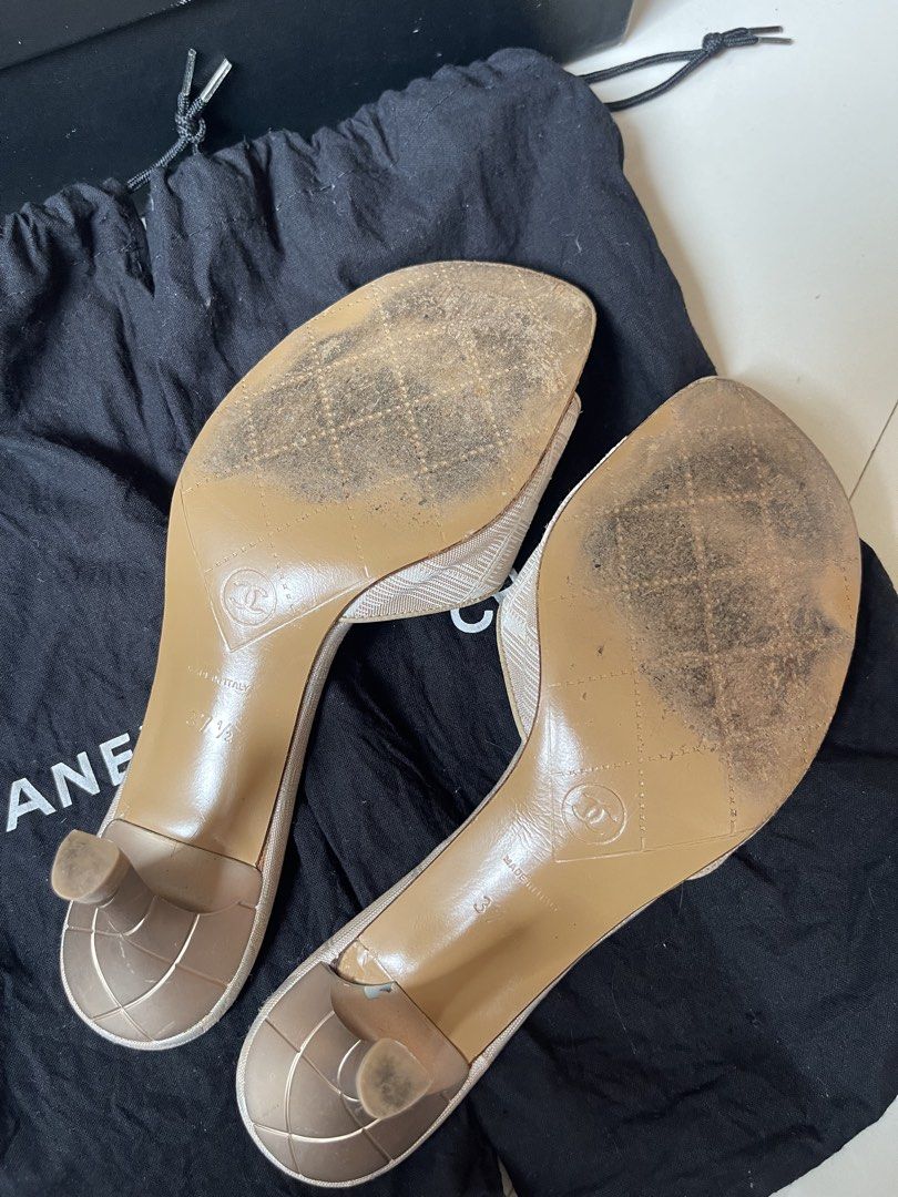 Chanel Travel line CC Canvas Heels (Category: Sneakers & Footwear) located in Davao. Submitted by boodle4lyf (Listing ID 1468104529, Image 3). Description: Authentic Chanel beige canvas CC logo mules in size 37.5, made in Italy. Features a slip-on kitten heel, quilted heel, and CC button accent. Shows significant wear on footbeds, toes, and soles. Includes original box and dust bag..