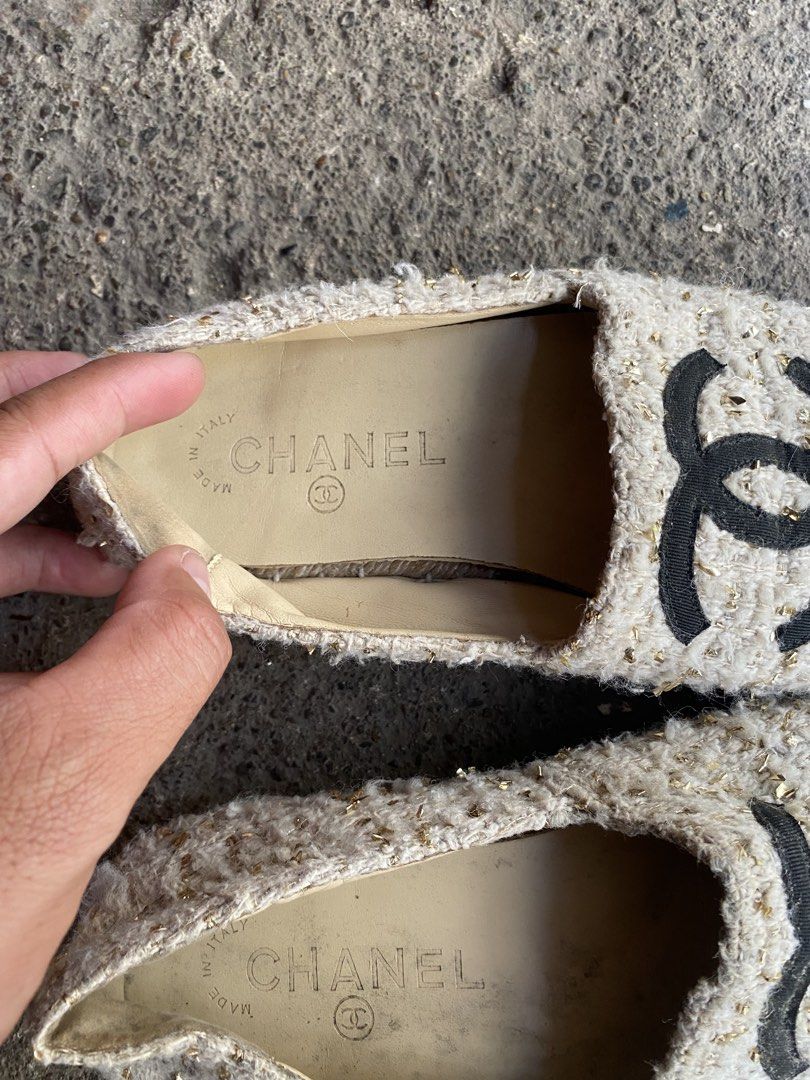 Chanel Tweed CC Espadrilles Size 38 (Category: Sneakers & Footwear) located in Alburquerque. Submitted by zanegavynn43872 (Listing ID 1468283356, Image 2). Description: - Brand: Chanel - Style: Slip-on espadrilles - Color/Material: Cream & gold metallic tweed with black fabric cap toe - Details: Iconic stitched CC logo, comfortable leather insoles, diamond-quilted rubber outsoles - Origin: Made in Italy - Size: EU 38 - Condition: Guaranteed authe