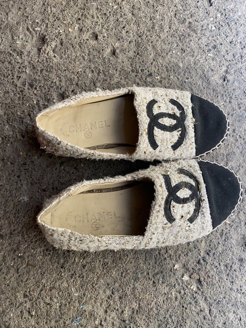 Chanel Tweed CC Espadrilles Size 38 (Category: Sneakers & Footwear) located in Alburquerque. Submitted by zanegavynn43872 (Listing ID 1468283356, Image 1). Description: - Brand: Chanel - Style: Slip-on espadrilles - Color/Material: Cream & gold metallic tweed with black fabric cap toe - Details: Iconic stitched CC logo, comfortable leather insoles, diamond-quilted rubber outsoles - Origin: Made in Italy - Size: EU 38 - Condition: Guaranteed authe
