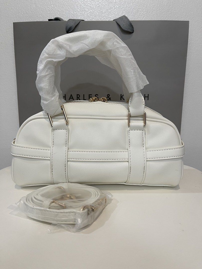 Charles & Keith Bowling Bag - White (Category: Shoulder Bags) located in Pasig City. Submitted by preloved.closet2 (Listing ID 1468085197, Image 2). Description: Bowling bag With Sling straps Color white Add paperbag plus 80 .