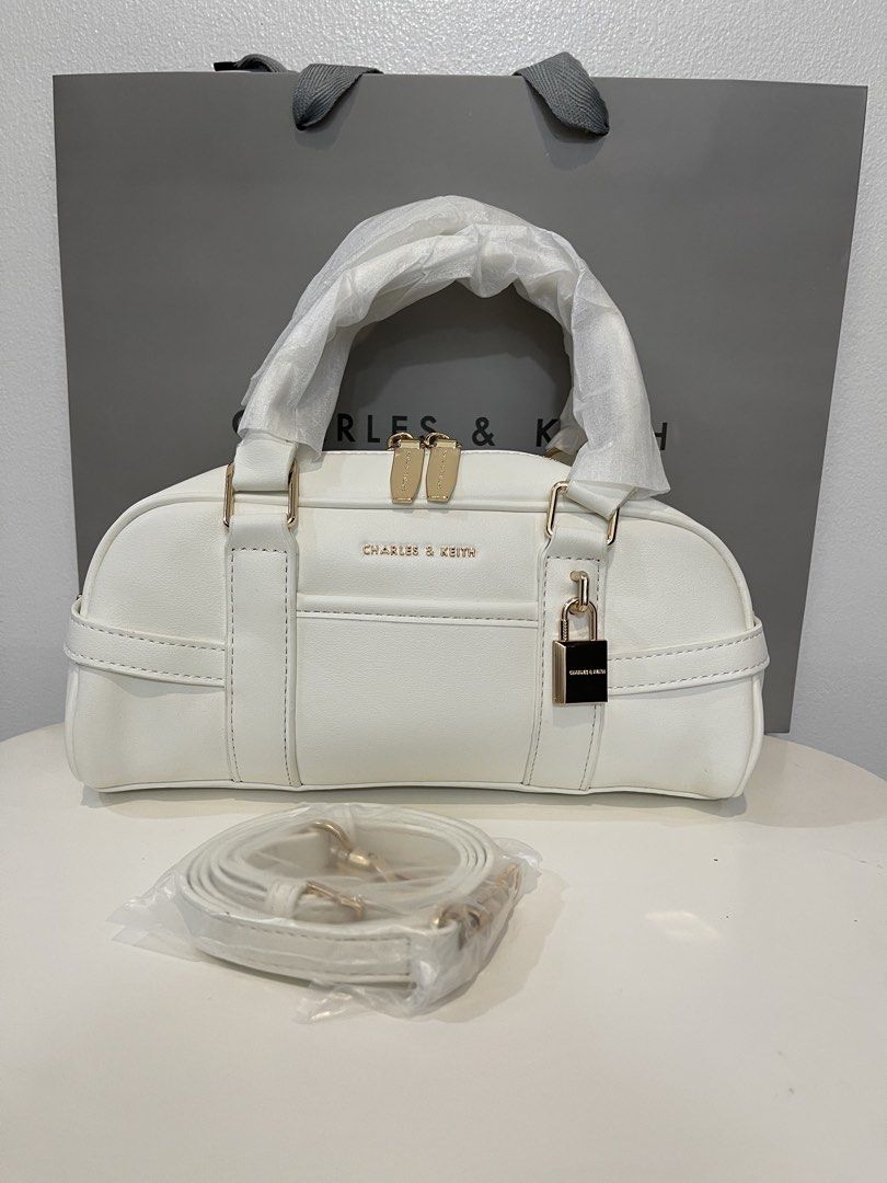 Charles & Keith Bowling Bag - White (Category: Shoulder Bags) located in Pasig City. Submitted by preloved.closet2 (Listing ID 1468085197, Image 1). Description: Bowling bag With Sling straps Color white Add paperbag plus 80 .