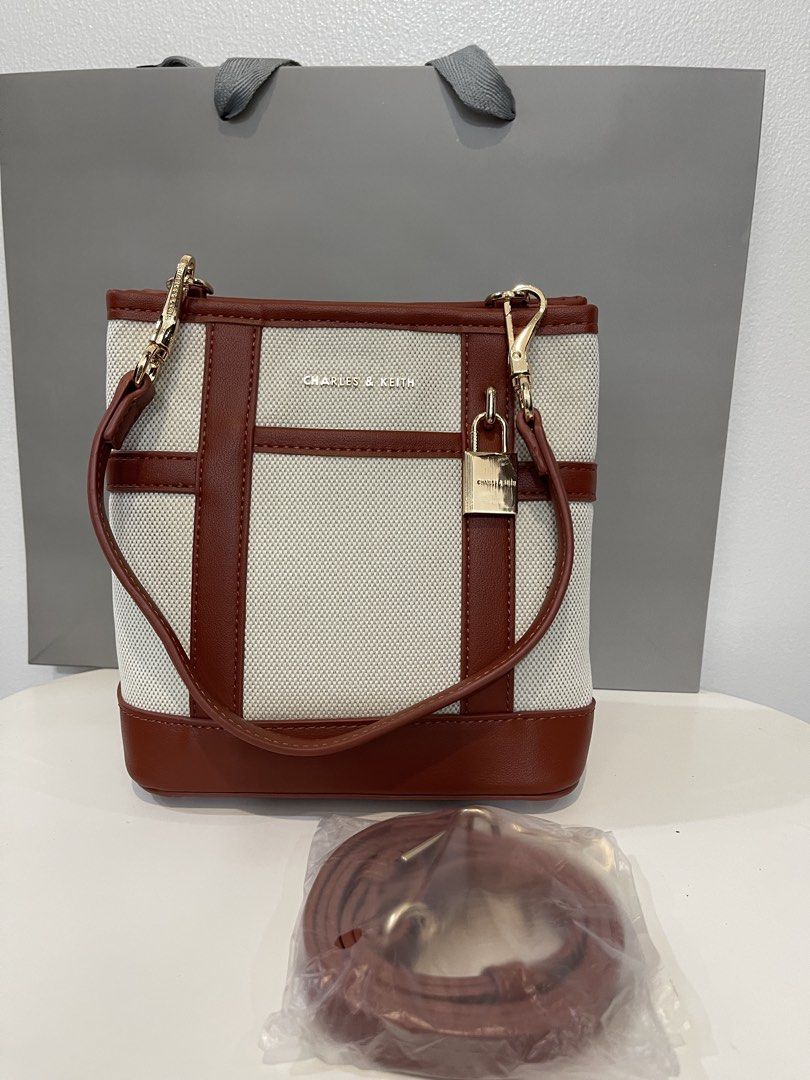 Charles & Keith Canvas Bucket Bag (Category: Shoulder Bags) located in Pasig City. Submitted by preloved.closet2 (Listing ID 1468083255, Image 2). Description: Bucket style bag With 2 straps 1 shoulder 1 Sling Color canvas 2tone Add paperbag plus 80 .