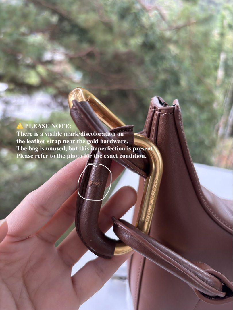 Charles & Keith Kora Metallic-Accent Moon Bag (Category: Shoulder Bags) located in Baguio. Submitted by thecuratedcartbymj (Listing ID 1468252015, Image 3). Description: Authentic Charles & Keith Kora Metallic-Accent Moon Bag Color: Brown Condition: Brand New / Unused (With original dust bag) ⚠️ PLEASE READ BEFORE BUYING (REASON FOR DISCOUNT): This gorgeous moon bag is completely brand new and has never been used. The interior, base, and main cre