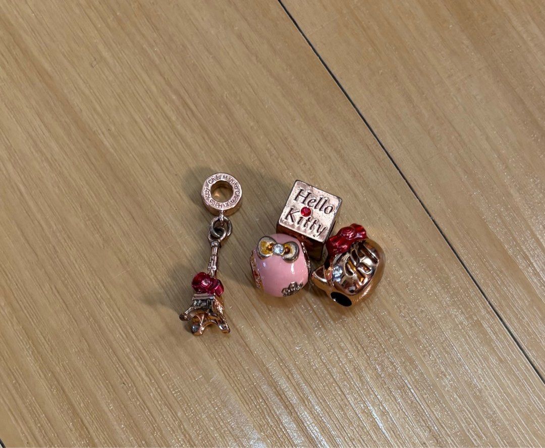 Chibi Maruko-Chan x Hello Kitty Charms Set (Category: Charms) located in Quezon City. Submitted by garagesale2026 (Listing ID 1468074655, Image 1). Description: - Preloved - With little tarnishings, SOLD AS IS, what you see is what you get - Original from Japan - Set of 4 charms; Can be sold per piece @Php350.00 each - Rose gold tone finish - Ideal for Hello Kitty collectors - No more box.