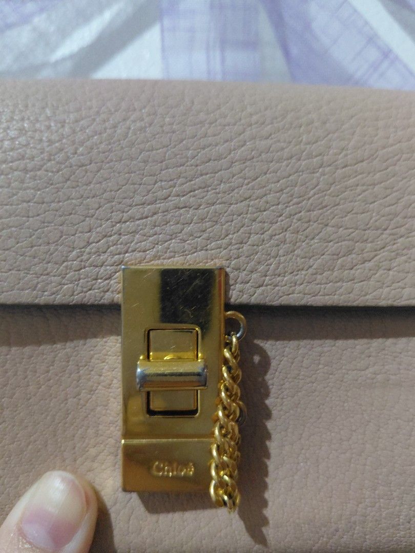 Chloé Drew Bifold Continental Wallet (Category: Wallets & Card holders) located in Tarlac. Submitted by wornwardrobe (Listing ID 1468279002, Image 2). Description: -Authentic Chloé Drew wallet -With coin and card slots inside -Hologram still intact -Scratches on hardware and some dirt/marks, see photos Kindly note that all items are stored at my parents’ house and not on hand. Retrieval takes up to 2 weeks before shipping. Please purchase only if