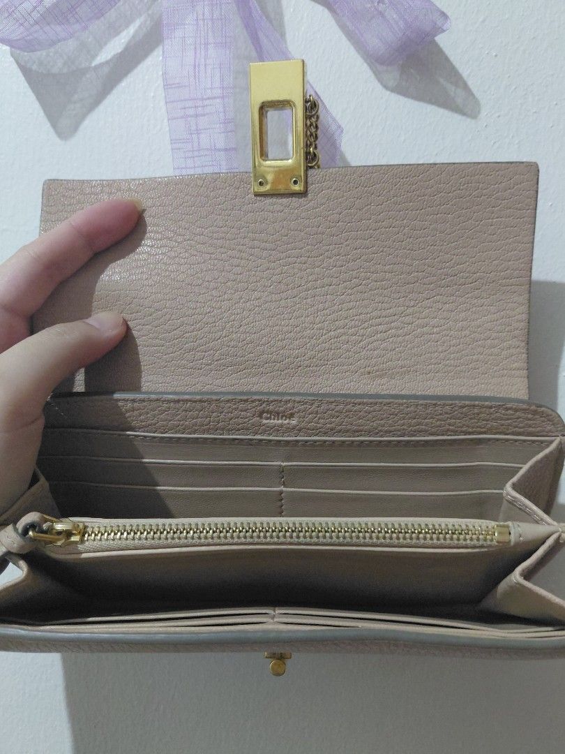 Chloé Drew Bifold Continental Wallet (Category: Wallets & Card holders) located in Tarlac. Submitted by wornwardrobe (Listing ID 1468279002, Image 3). Description: -Authentic Chloé Drew wallet -With coin and card slots inside -Hologram still intact -Scratches on hardware and some dirt/marks, see photos Kindly note that all items are stored at my parents’ house and not on hand. Retrieval takes up to 2 weeks before shipping. Please purchase only if