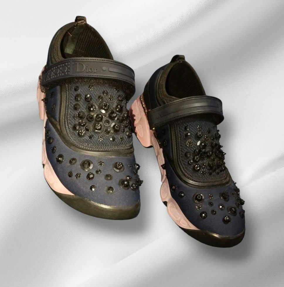Christian Dior Embellished Sneakers (Category: Sneakers) located in Paranaque City. Submitted by calm_youngstore7 (Listing ID 1468228312, Image 1). Description: - Brand: Dior - Color: Dark blue with pink translucent soles - Details: Upper heavily embellished with black crystals and beads - Features: Hook and loop top strap with Dior branding, rhinestone heel strip, slip-on design, and rear pull tabs - Condition: Shows normal signs of wear on the 