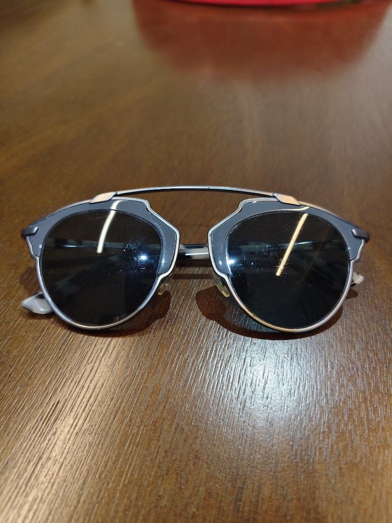 Christian Dior So Real Sunglasses (Category: Sunglasses & Eyewear) located in Manila. Submitted by christophe44164 (Listing ID 1468181112, Image 1). Description: - Brand: Christian Dior So Real - Color: Tortoise shell and grey - Design: Unique architectural frame with metal top bar - Origin: Made in Italy - Size: 48-22-140 - Condition: Normal signs of wear on lenses and frames - Deal: Authentic designer piece at a fraction of retail price!.