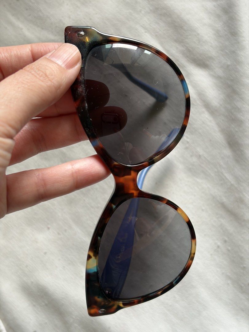 Christian Dior Tortoiseshell Sunglasses with Blue Temples (Category: Sunglasses & Eyewear) located in Pasig City. Submitted by sherlock2024 (Listing ID 1468062163, Image 3). Description: - Brand: Christian Dior Designer Sunglasses - Frame: Tortoiseshell front with contrasting blue temples - Lenses: Dark gradient - Details: Silver Dior logo lettering on the sides - Inclusions: Original black branded box - Condition: Excellent / Well-maintained - S
