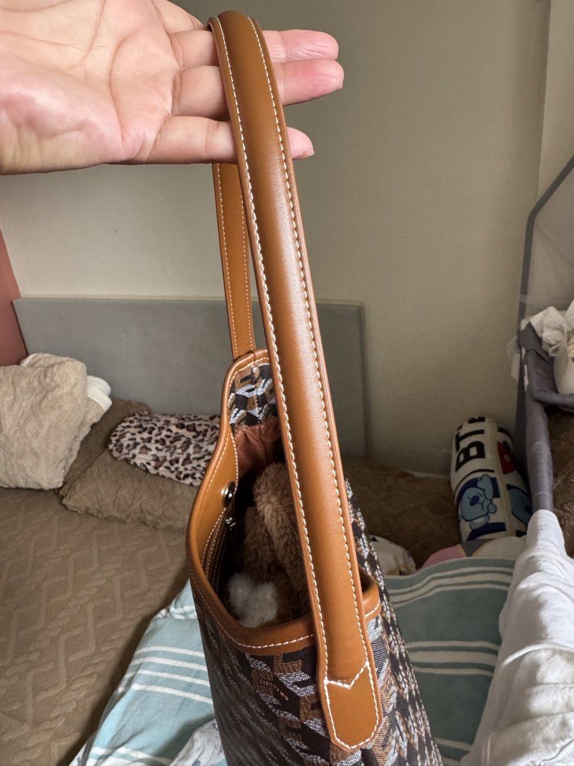 Christy Ng Medium Alesso Hobo Bag (Category: Shoulder Bags) located in Manila. Submitted by realprelovedbylmhr (Listing ID 1468097592, Image 3). Description: - Brand: Christy Ng - Design: Brown geometric monogram pattern with tan leather-look trim and white contrast stitching - Structure: Open top design with a sleek, structured shape - Interior: Brown fabric lining with a convenient zip pocket - Condition: Clean exterior and interior, well-maint