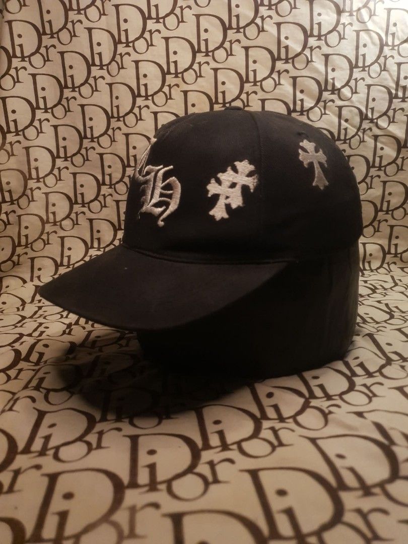 CHROME HEARTS CAP (Category: Caps & Hats) located in San Fernando. Submitted by _jaximus (Listing ID 1468216822, Image 2). Description: - Brand: Chrome Hearts - Color: Classic Black - Design: Large gothic CH logo embroidery on the front - Details: Premium white cross patches stitched along the sides and crown - Fit: Adjustable snapback closure with branded embroidery above the strap - Style: Streetwear essential, highly detailed embroidery throug