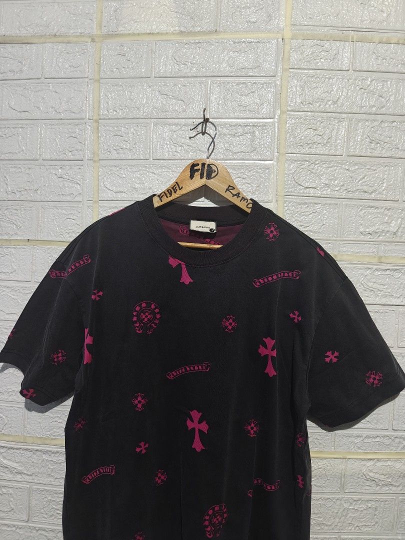 Multi-Print T-Shirt Black Pink (Category: Tshirts & Polo Shirts ) located in Manila. Submitted by fideldelrosario1 (Listing ID 1468205502, Image 2). Description: - Color: Black with pink and dark red prints - Design: All-over crosses, horseshoes, and scroll graphics - Details: Classic horseshoe logo on the chest pocket area and a huge horseshoe print on the back - Fit: Regular fit with crew neck and standard short sleeves - Perfect for: Streetwea