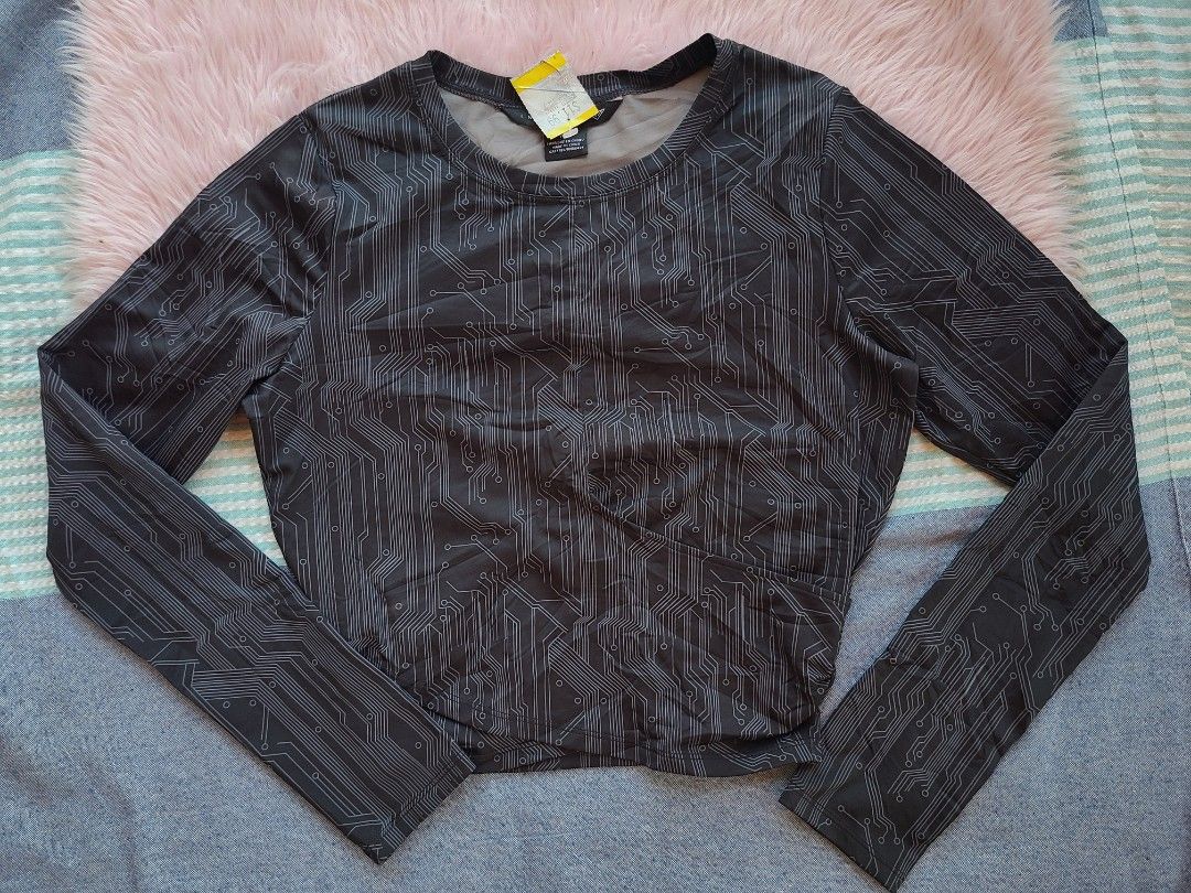 Circuit Board Pattern Long Sleeve Top (Category: Longsleeves) located in Lingayen. Submitted by chloeswhite (Listing ID 1468105929, Image 1). Description: - Color & Print: Black with an all-over grey circuit board print - Design: Round neckline with a trendy wrapped cropped hem - Fit & Sizing: Measures about 18 inches across the chest; material has some stretch - Condition: Brand new with original store tag still attached on the collar.