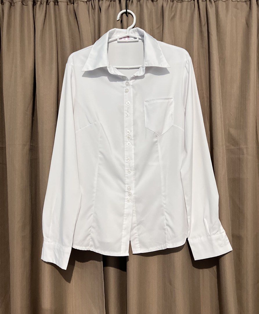 Classic White Long Sleeve Button-Up Work Blouse (Category: Blouses) located in Cainta. Submitted by periwinkle.ph (Listing ID 1468201137, Image 1). Description: - Color: Clean white - Style: Fitted button-down shirt with tailored front darts - Collar & Pockets: Pointy collar and single chest pocket on the right side - Sleeves: Long sleeves with buttoned cuffs and standard front button closure - Fabric: Lightweight and versatile - Best for: Office