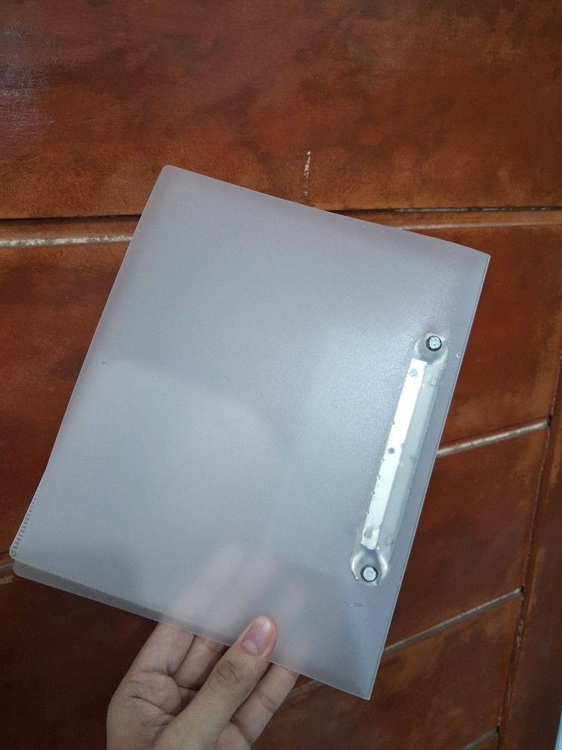 MUJI Clear frosted clipboard folder with ring binder (Category: Stationery & School Supplies) located in Legazpi City. Submitted by flordelotus (Listing ID 1468094810, Image 3). Description: MUJI A5 2-Ring Binder – Translucent Gray Pre-loved MUJI A5 polypropylene binder in translucent gray. Perfect for organizing notes, school papers, and documents. • A5 size • 2 metal rings • With built-in back pocket • Has some scratches from use, but still fun