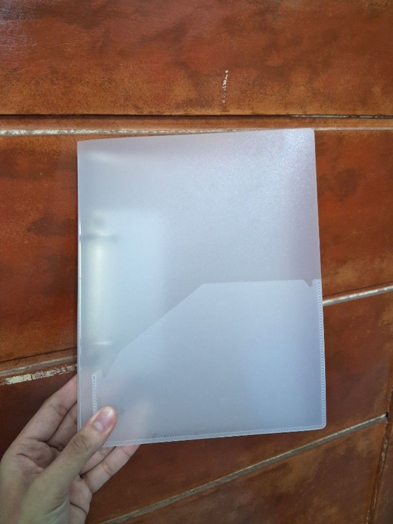 MUJI Clear frosted clipboard folder with ring binder (Category: Stationery & School Supplies) located in Legazpi City. Submitted by flordelotus (Listing ID 1468094810, Image 1). Description: MUJI A5 2-Ring Binder – Translucent Gray Pre-loved MUJI A5 polypropylene binder in translucent gray. Perfect for organizing notes, school papers, and documents. • A5 size • 2 metal rings • With built-in back pocket • Has some scratches from use, but still fun