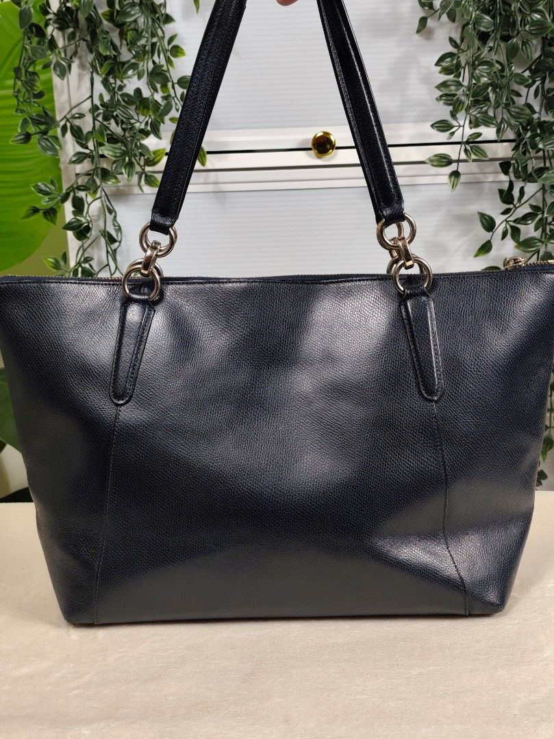 Coach Ava Chain Tote (Authentic/OG) (Category: Luxury Bags & Wallets) located in General Trias. Submitted by _roseandcarry (Listing ID 1468084176, Image 2). Description: Coach Ava Chain Tote - Midnight Blue / Navy Blue 🏷️ Style Code: F24961 (2015) 🔎 Authenticity: Authentic/OG 🇯🇵 sourced 👉🏻 Issues: Minor portion of the handle rubber lining is missing (painted black to blend in), light scuffing on the corners, creasing on the lower body when 