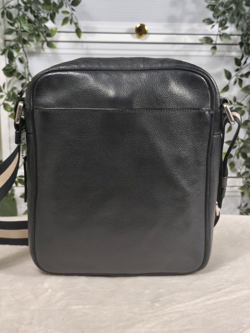 Coach Charles Flight Bag (Authentic/OG) (Category: Luxury Bags & Wallets) located in General Trias. Submitted by _roseandcarry (Listing ID 1468078761, Image 2). Description: Coach Charles Flight Bag - Black 🏷️ Style Code: F54782 (2017) 🔎 Authenticity: Authentic/OG 🇯🇵 sourced 👉🏻 Issues: No major flaws. Stain on the inner lining of the back slip pocket, and minor surface creases and scuffs on the rubber lining. • Materials: Crafted from premi