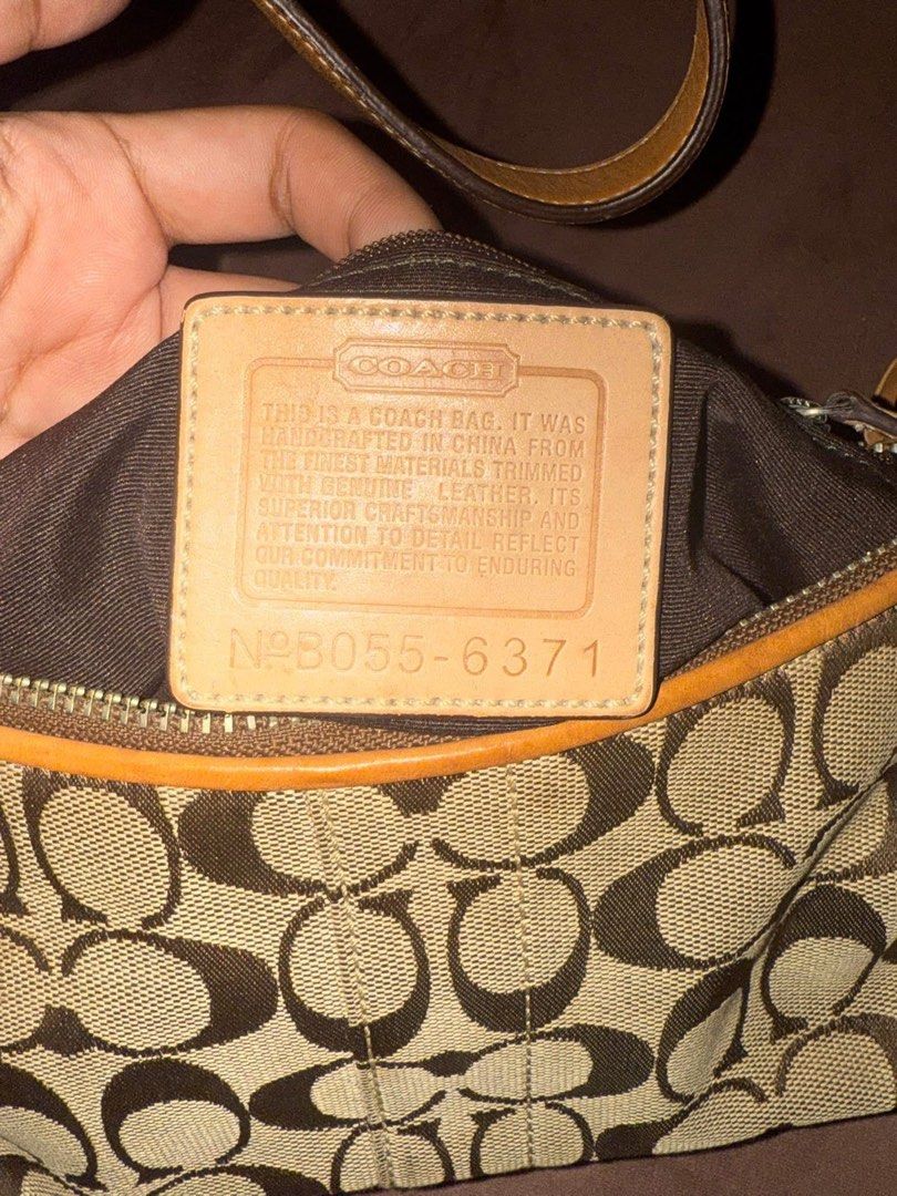 Coach eastwest baguette (Category: Luxury Bags & Wallets) located in Manila. Submitted by esethy (Listing ID 1468060924, Image 3). Description: - Authentic Coach signature C jacquard fabric with tan leather trim - Classic shoulder bag silhouette with secure top zip closure - Single adjustable leather strap with matching hangtag - Clean interior with creed patch and serial number B055-6371 - Dark brown fabric lining - Minor signs of everyday wear 