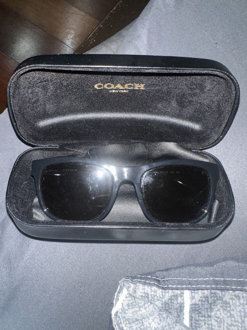 Coach HC 8212 Black Sunglasses with Case (Category: Sunglasses & Eyewear) located in Dasmarinas. Submitted by kyle_47 (Listing ID 1468145274, Image 1). Description: - Brand: Coach - Model: HC 8212 (L1641) - Color: Classic black frames with dark tinted lenses - Inclusions: Original Coach New York hard case with velvet lining - Condition: Sturdy frame construction, great for everyday use.