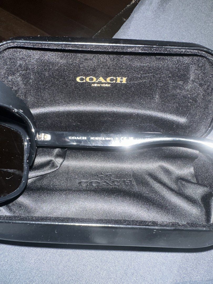 Coach HC 8212 Black Sunglasses with Case (Category: Sunglasses & Eyewear) located in Dasmarinas. Submitted by kyle_47 (Listing ID 1468145274, Image 2). Description: - Brand: Coach - Model: HC 8212 (L1641) - Color: Classic black frames with dark tinted lenses - Inclusions: Original Coach New York hard case with velvet lining - Condition: Sturdy frame construction, great for everyday use.