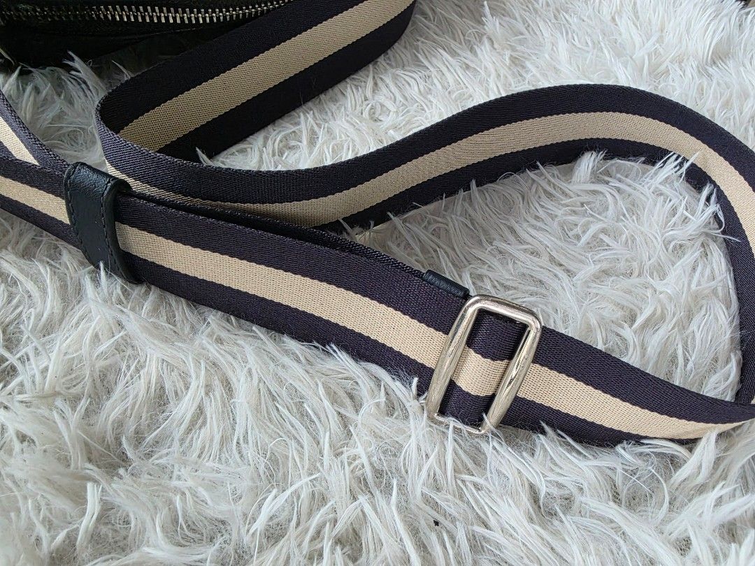 Coach Leather Crossbody Bag Black (Category: Cross-body Bags) located in Lemery. Submitted by venus23 (Listing ID 1468221748, Image 3). Description: - Brand: Coach - Material: Genuine black leather with pebbled texture - Color: Black with navy and tan webbed strap - Hardware: Silver-tone - Closure: Top zip closure - Compartments: Main compartment and front slip pocket - Strap: Thick, adjustable webbed strap - Dimensions: Roughly 25cm (W) x 26cm (
