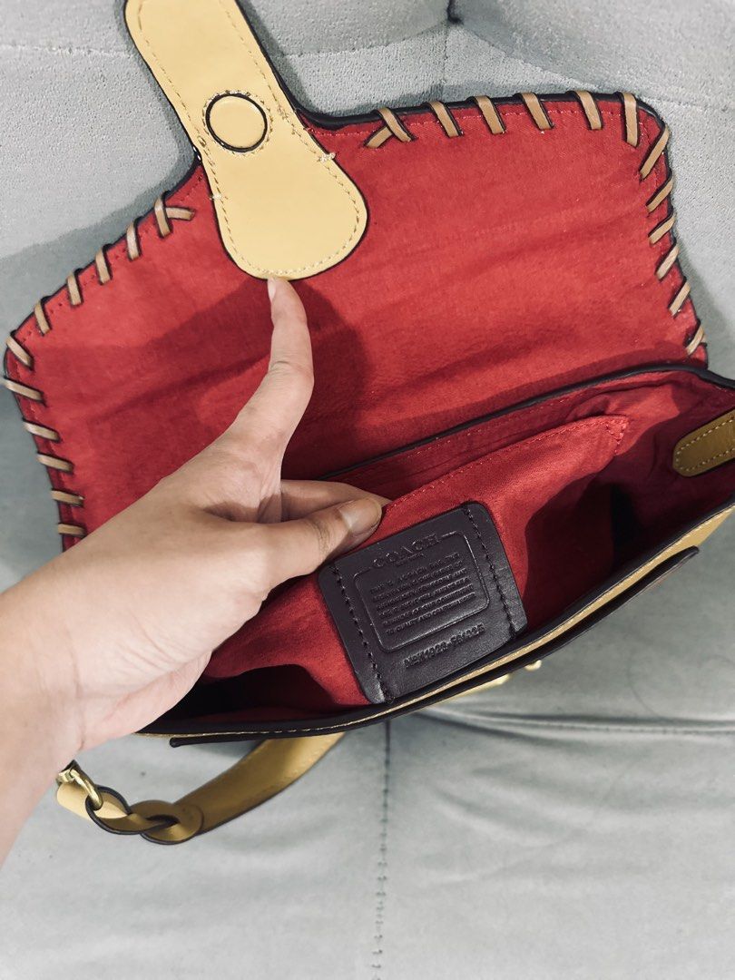 Coach Leather Crossbody Bag Tan Multicolour (Category: Cross-body Bags) located in Tarlac. Submitted by via_banana (Listing ID 1468095934, Image 3). Description: - Brand: Coach - Design: Tan and mustard colorblock with contrast whipstitch details - Closure: Turnlock closure on front flap - Interior: Bright red lining with a convenient slip pocket - Exterior: Back zipper pocket for extra storage - Hardware: Brass-tone hardware with signature strap