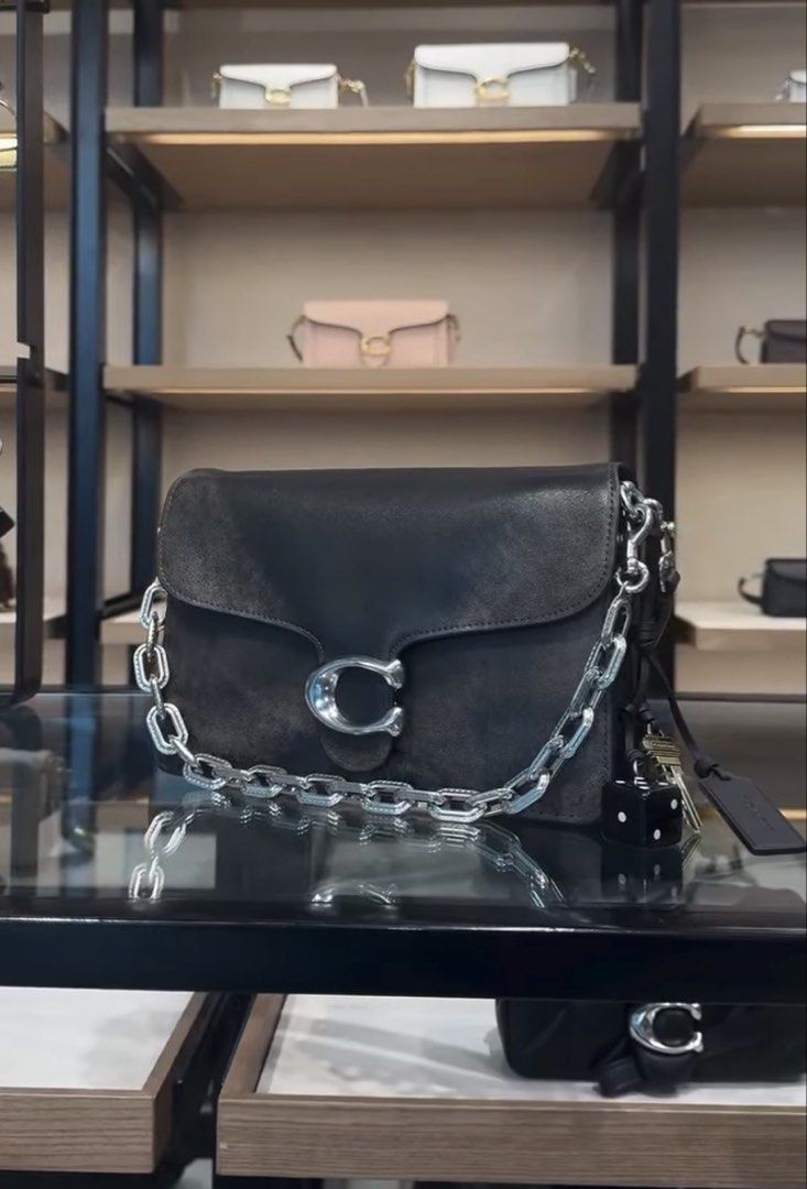 Coach Tabby Chain Loved Leather SHW (Category: Luxury Bags & Wallets) located in Pasig City. Submitted by the90sph (Listing ID 1468110341, Image 2). Description: - Brand: Coach (bought straight from the official store Japan) - Material: Distressed brown leather - Hardware: Chunky silver chain with iconic C logo clasp - Strap: Black leather shoulder strap and long strap - Inclusions: original paper bag - Condition: Guaranteed authentic and brand n