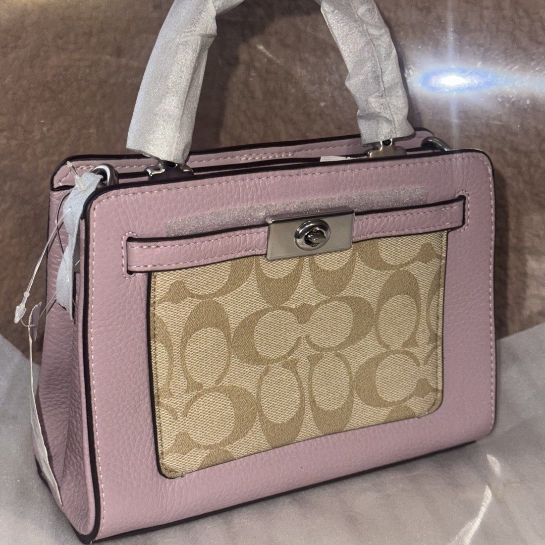 Coach mini lane top handle (Category: Shoulder Bags) located in Baguio. Submitted by wanderlust.pinas (Listing ID 1468064056, Image 2). Description: BRAND NEW (na-stock lang) for only P3XXX only - COACH MINI LANE 💜 (with thin strap) (sealed) (complete inclusion with tag intacked and care card) For more details send a message Disclaimer Wanderlust Pinas is Not affiliated with any trademarks/brands posted.