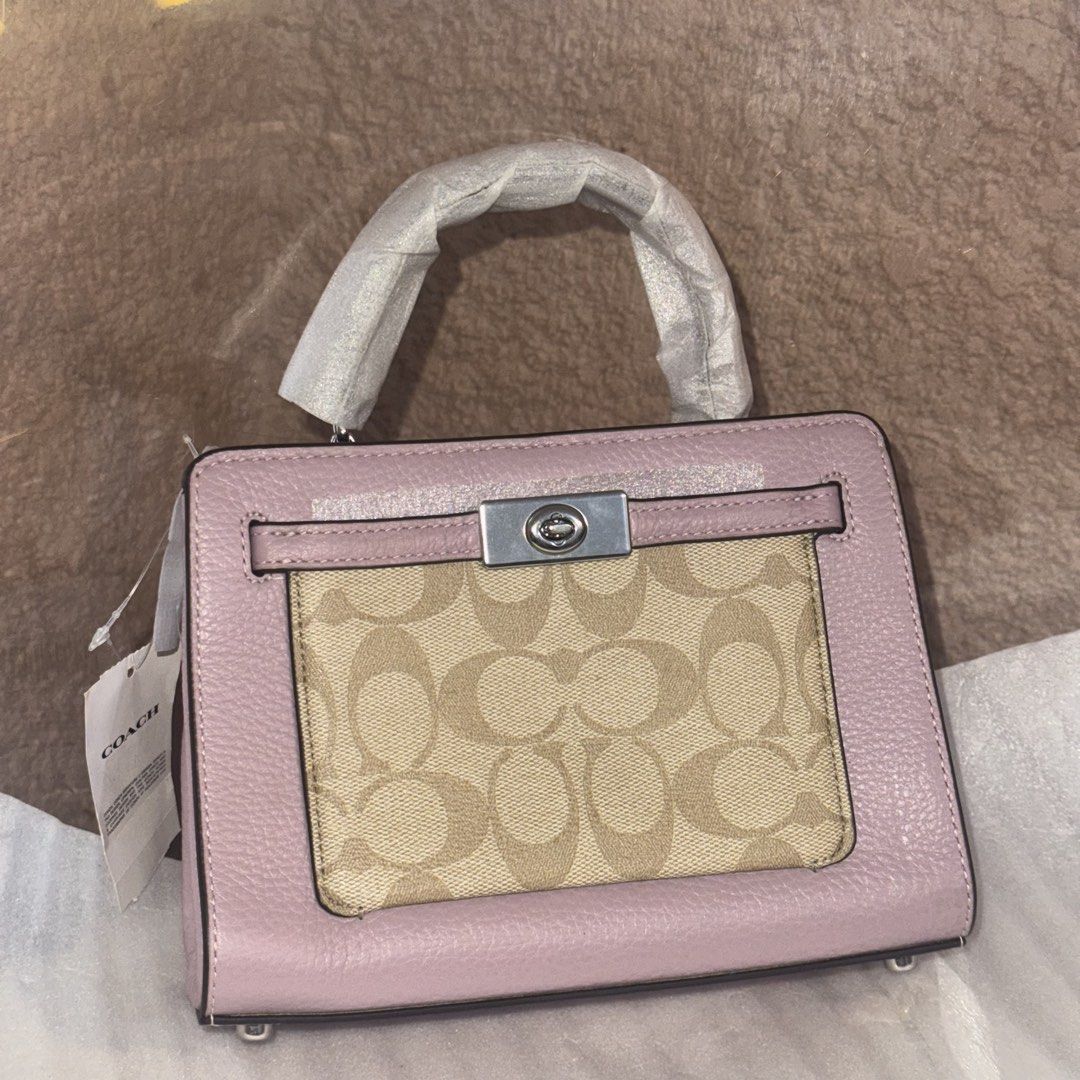 Coach mini lane top handle (Category: Shoulder Bags) located in Baguio. Submitted by wanderlust.pinas (Listing ID 1468064056, Image 1). Description: BRAND NEW (na-stock lang) for only P3XXX only - COACH MINI LANE 💜 (with thin strap) (sealed) (complete inclusion with tag intacked and care card) For more details send a message Disclaimer Wanderlust Pinas is Not affiliated with any trademarks/brands posted.