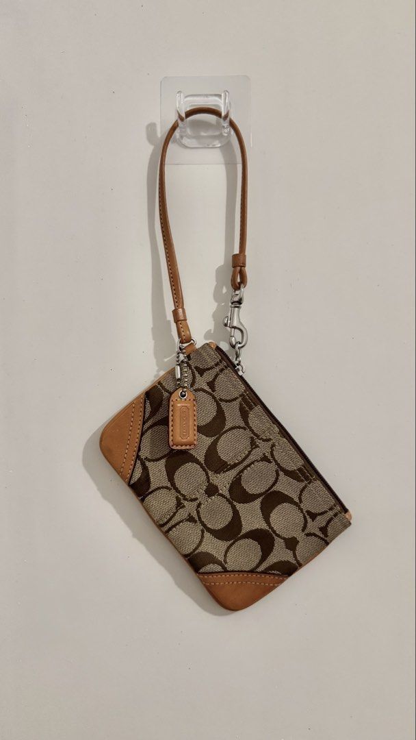 Coach signature canvas wrislet (Category: Luxury Bags & Wallets) located in Manila. Submitted by av.444_ (Listing ID 1468073566, Image 1). Description: Good as new, no issues at all.